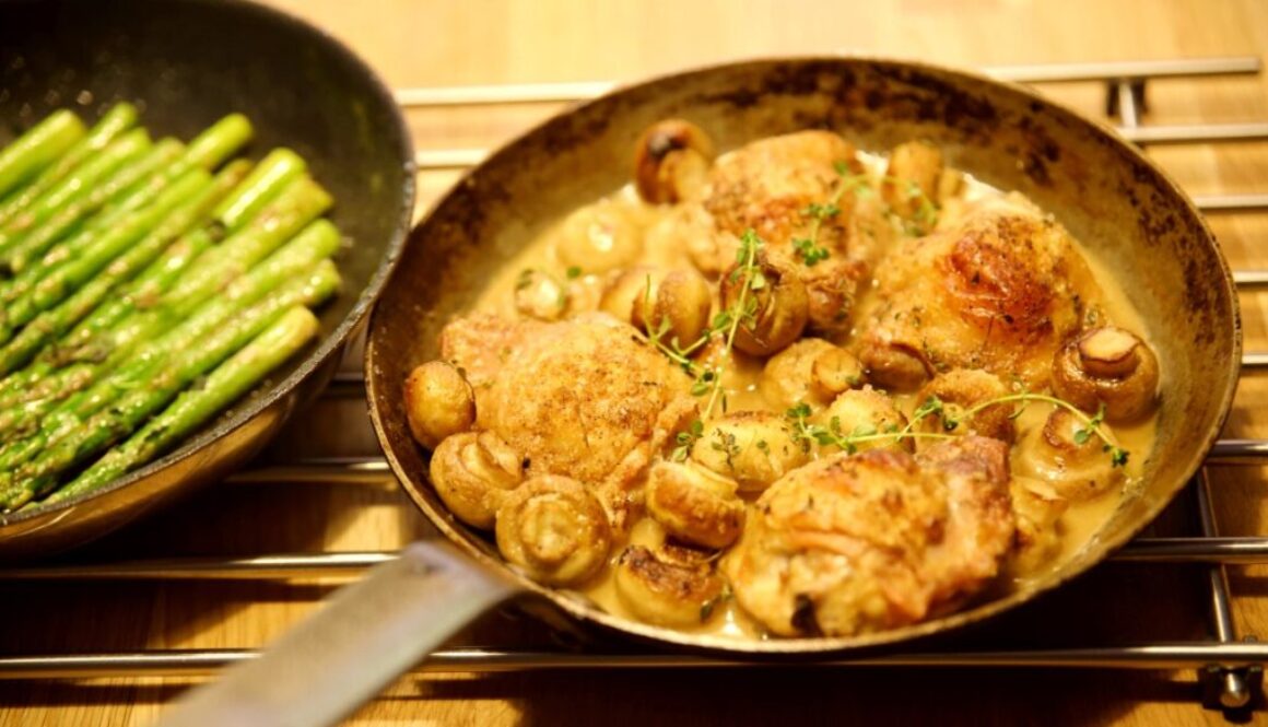 Roasted chicken with mushrooms in a white wine sauce with mint asparagus