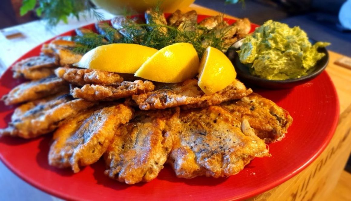 Fried Atlantic herring with wild garlic-herb butter