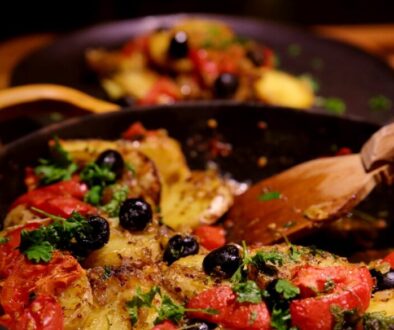 Potato and tomato casserole with black olives