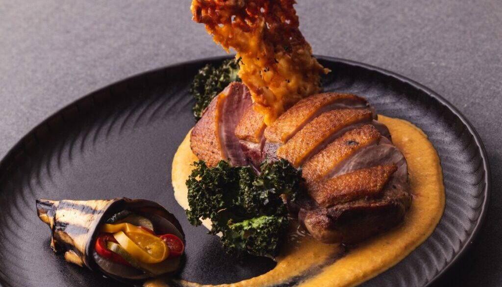 Duck fillet with ratatouille and kale chips