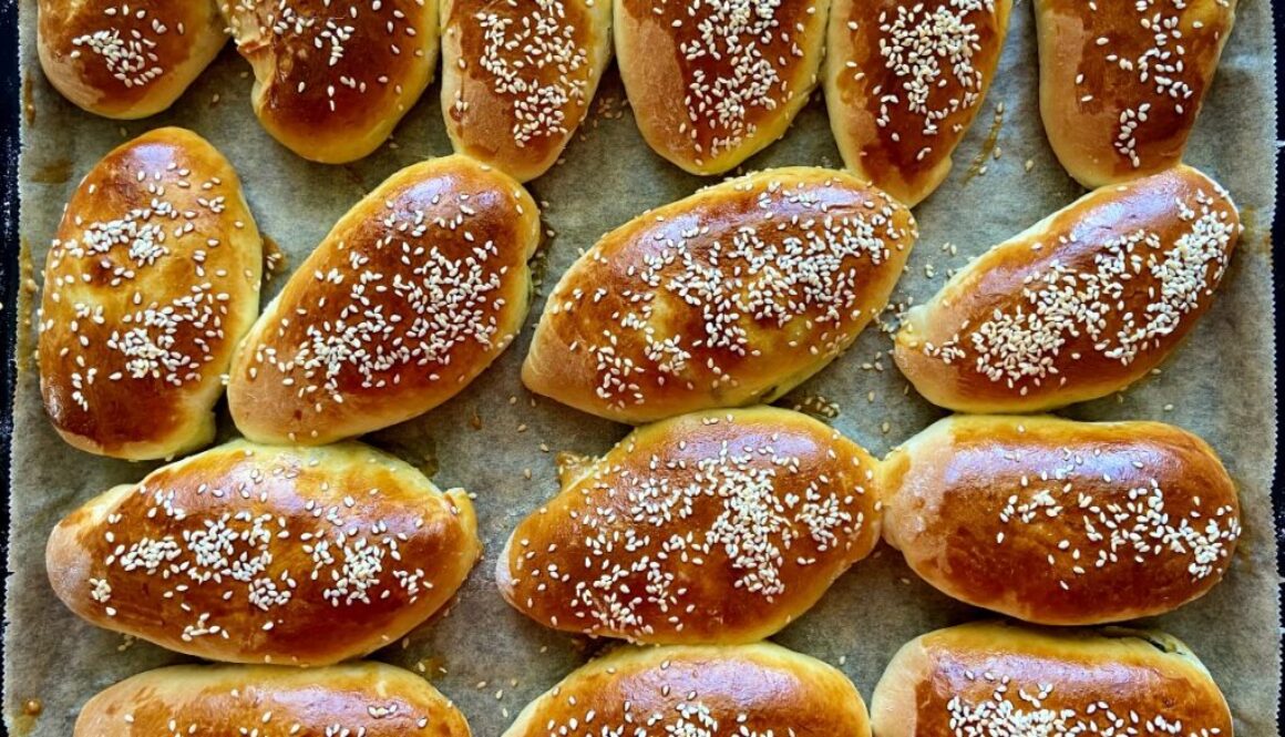 Yeast dough pies with green onions and eggs