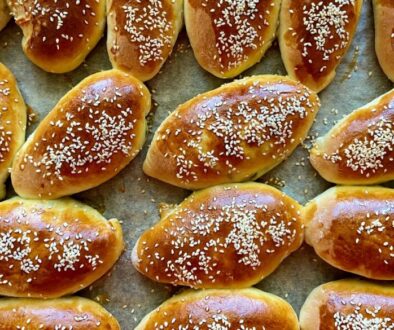 Yeast dough pies with green onions and eggs