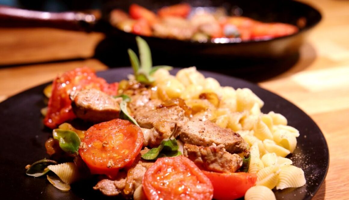 Pork tenderloin with onions, fried tomatoes, and sage
