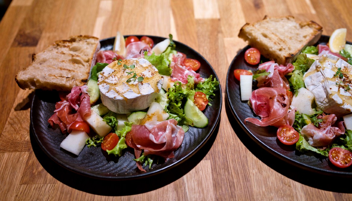 Camembert cheese salad with melon and Parma ham